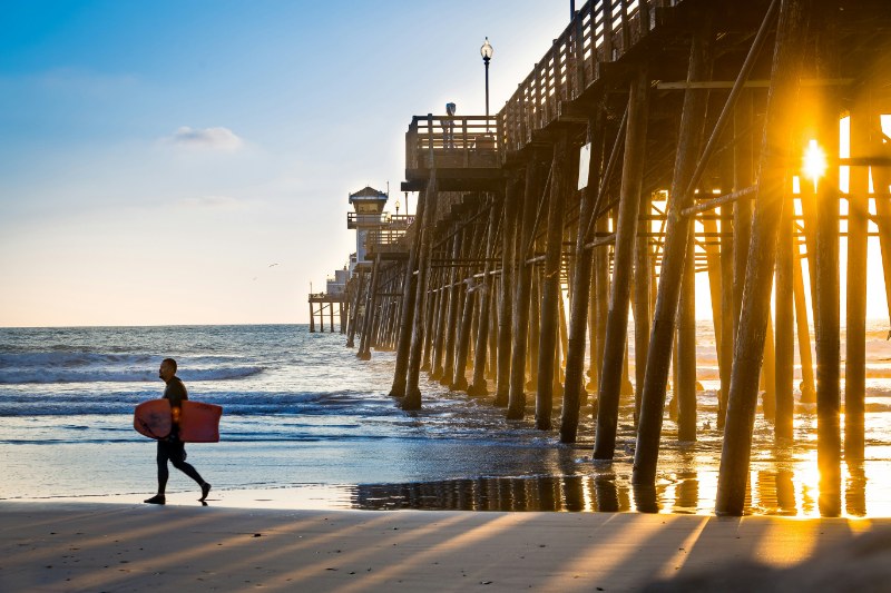 guy walking on seashore